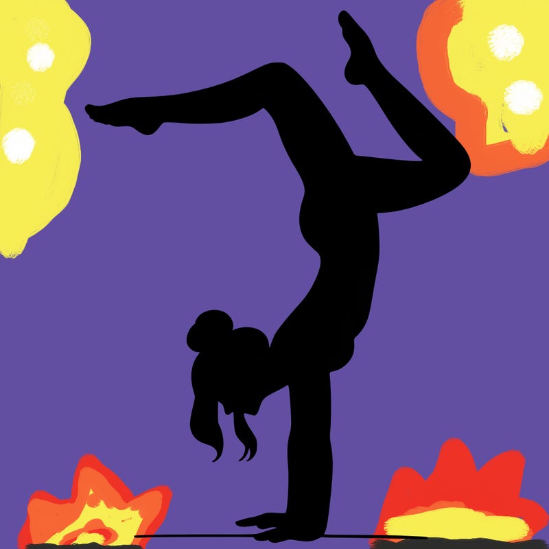 a woman doing a handstand