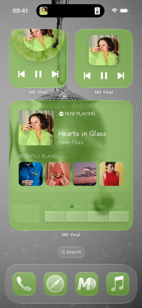 An aesthetic iPhone home screen featuring various green MD Vinyl widgets showing a spinning record player and recently played music