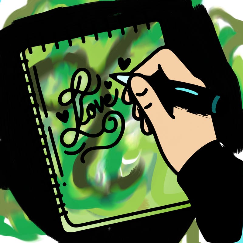 a hand writing “love” in calligraphy on a notebook