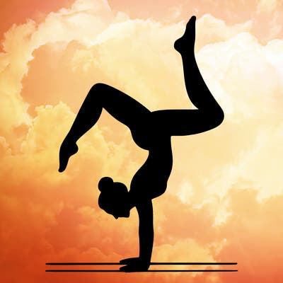 a woman doing a handstand