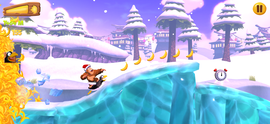 Banana Kong 2 - Banana Kong con un sombrero de Santa montando un pingüino en un nivel ártico nevado