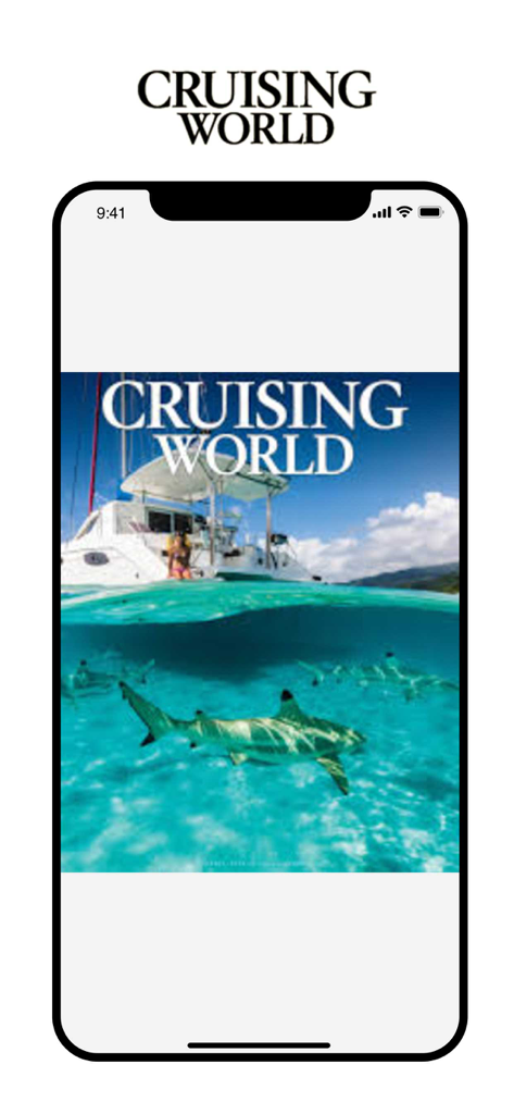 Cruising World Magazine - Cruising World Magazine app displayed on a smartphone featuring a sailing catamaran and a shark in turquoise water