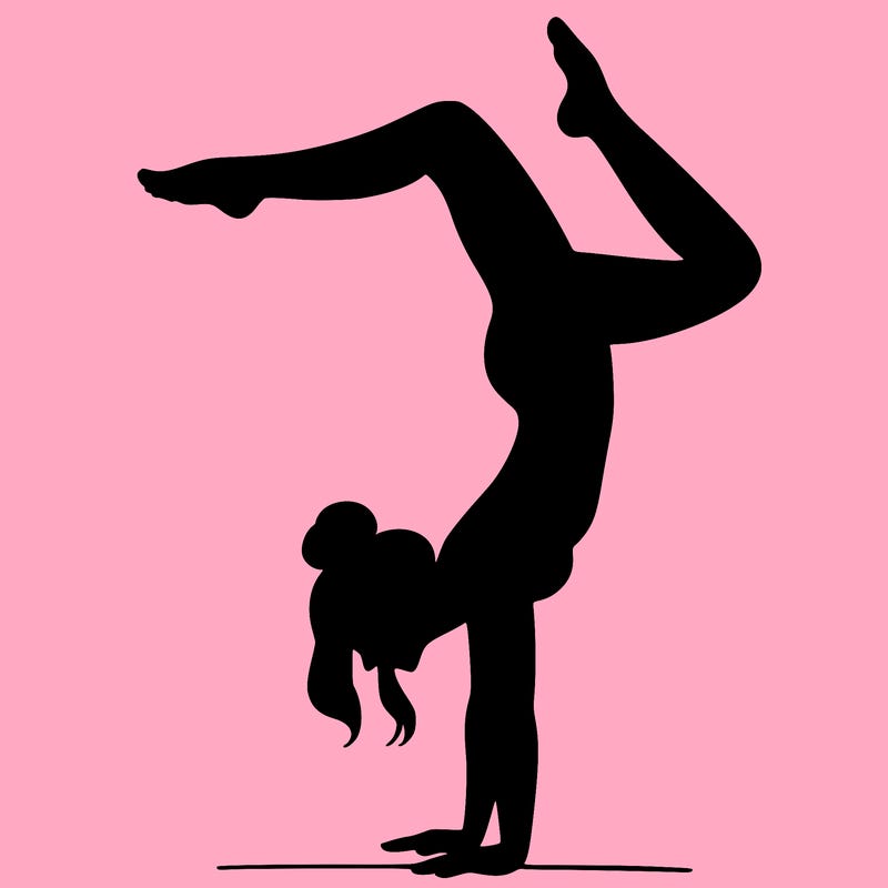 a woman doing a handstand