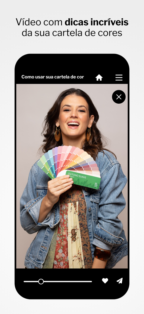 A woman holding a color palette fan in a personal styling video tutorial