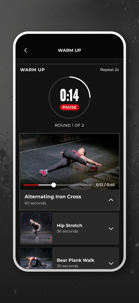 A mobile screen from the Spartan Race app showing a warm up routine with a video of a person doing an exercise and a countdown timer.