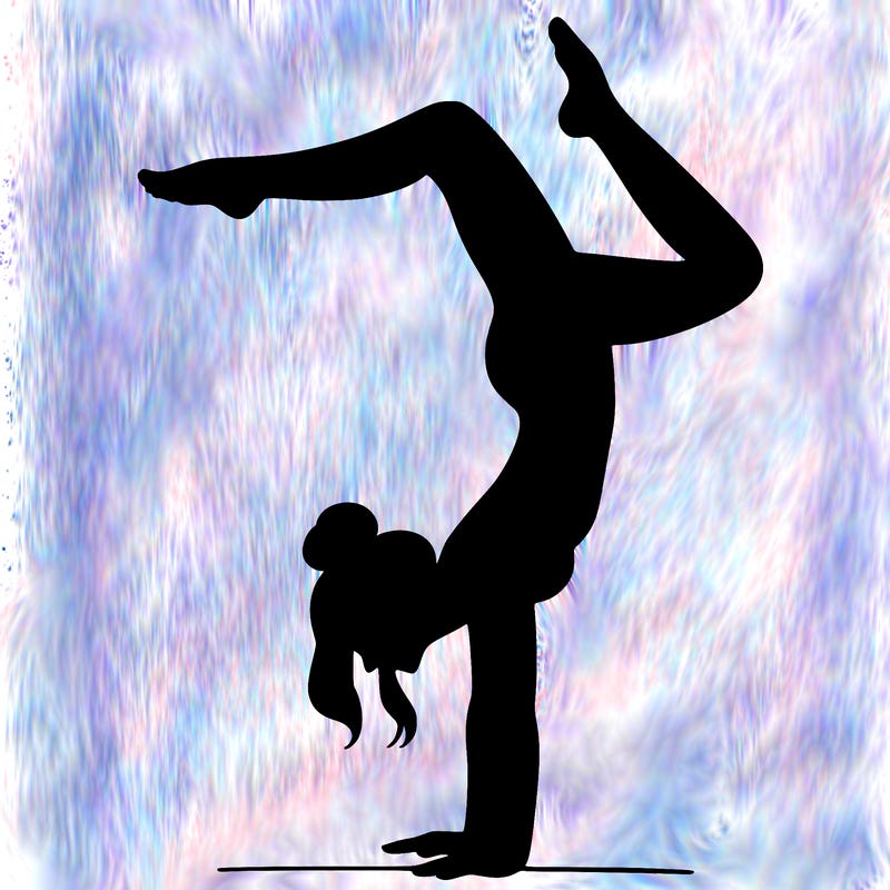 a woman doing a handstand