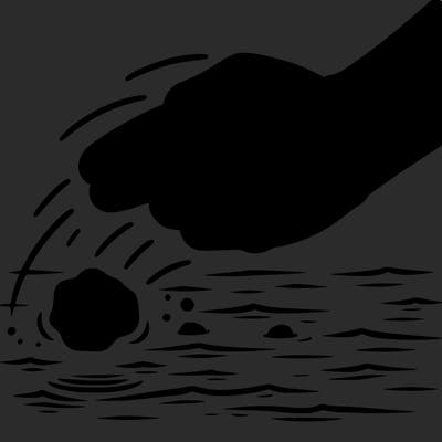 hand throwing rock into water