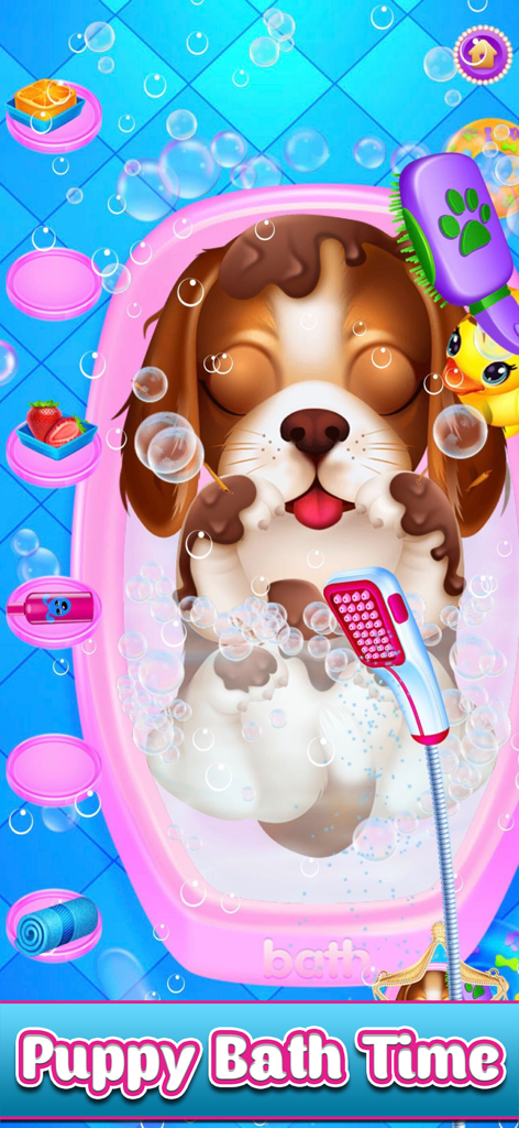 A cute brown and white puppy getting a bubble bath in a pink tub with a shower head and grooming tools.