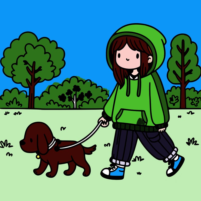 girl with a baggy hoodie walking her dog in a park
