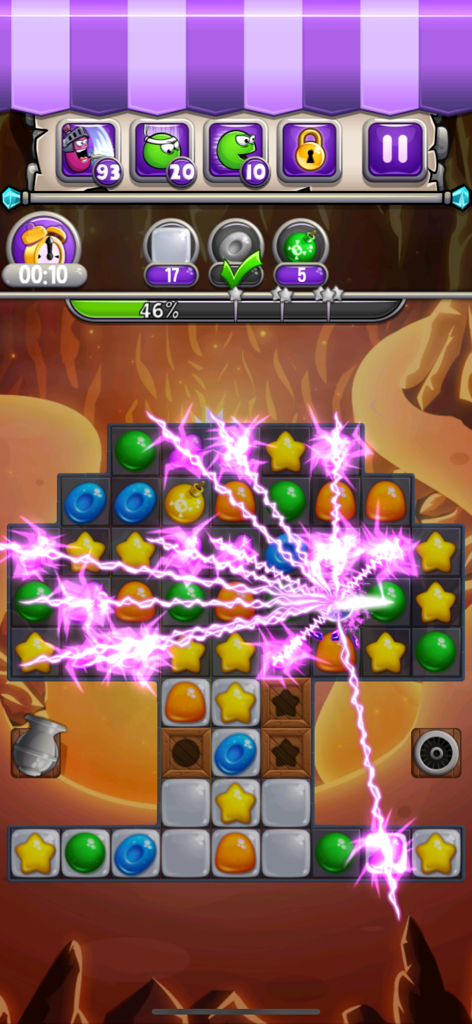 Jugabilidad del puzzle de combinar 3 de Jewel World Candy Deluxe con un efecto de poder de rayo morado que limpia piezas de caramelo