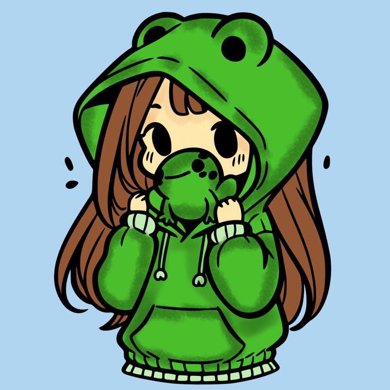 a girl holding a froggy hoodie