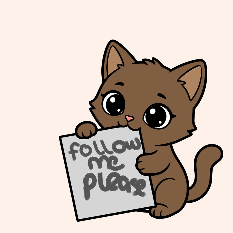 a small cat with a blank sheet of paper in its hand. the cat is sooooooo cute!