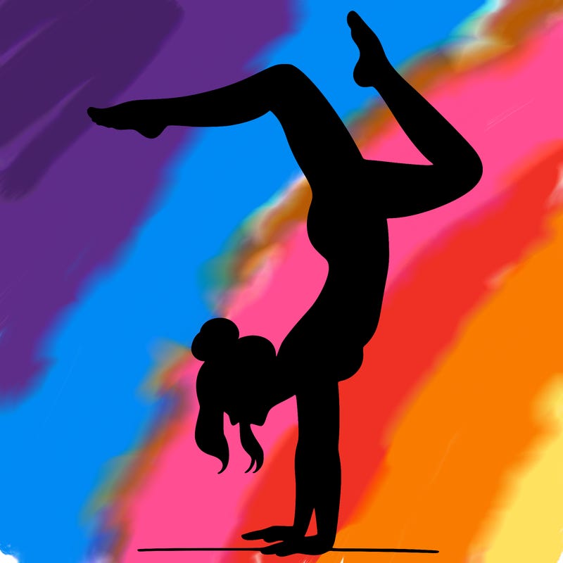 a woman doing a handstand