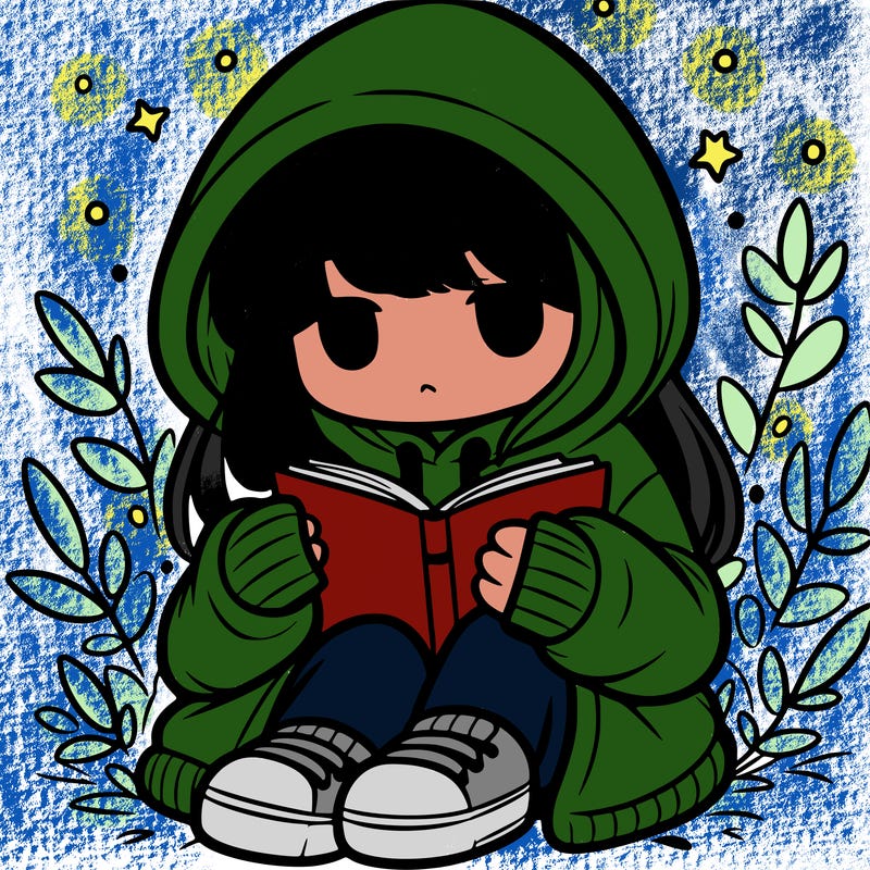 girl in oversized hoodie reading a book
