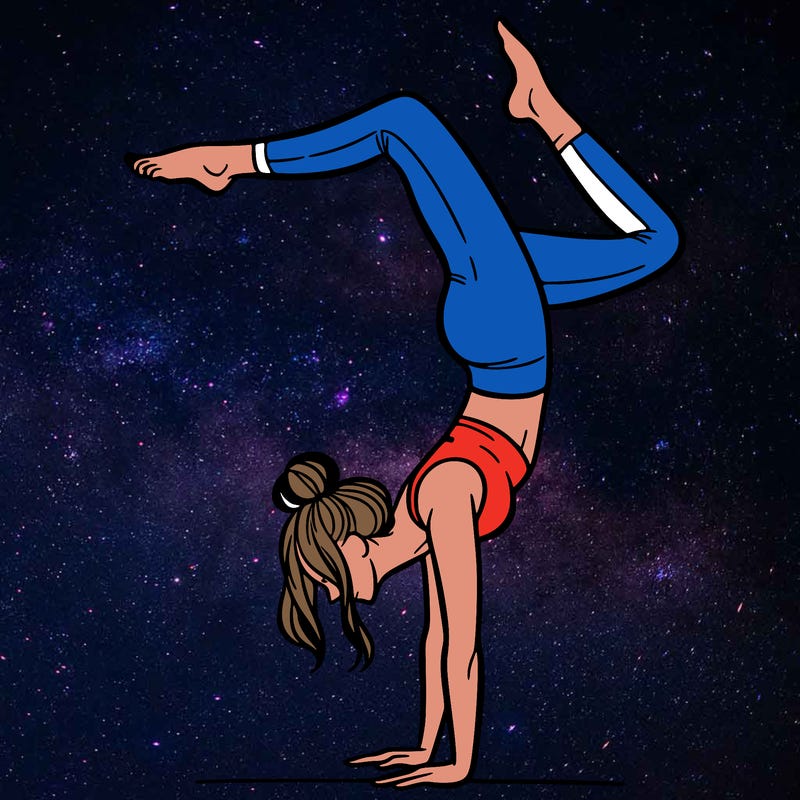 a woman doing a handstand