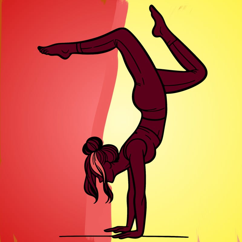 a woman doing a handstand