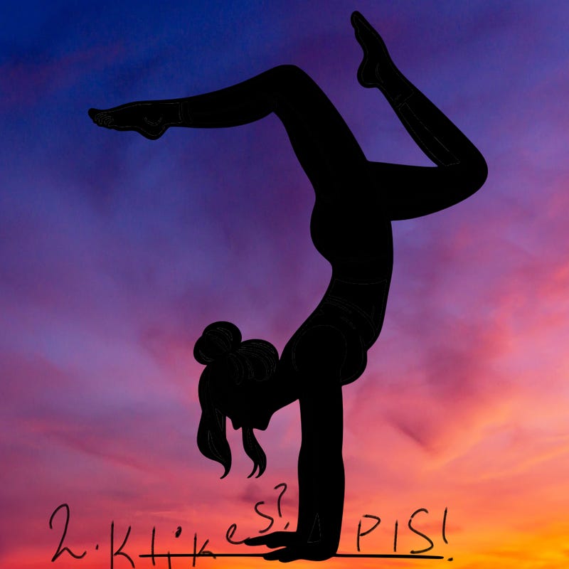 a woman doing a handstand