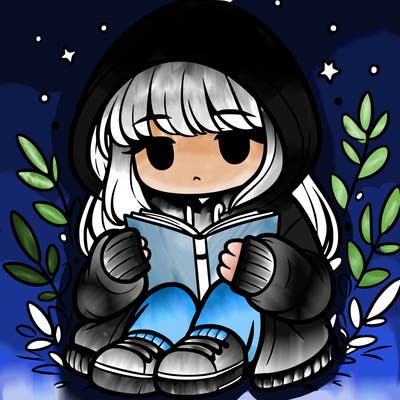 girl in oversized hoodie reading a book