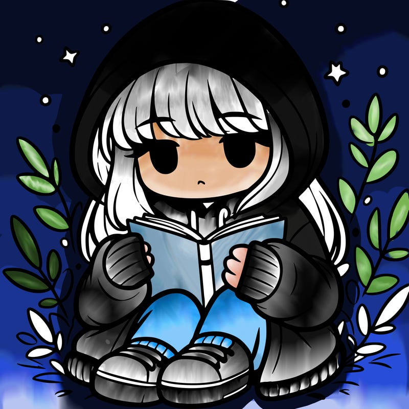 girl in oversized hoodie reading a book