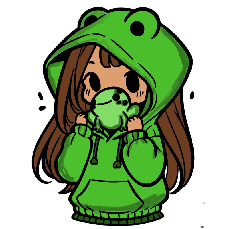 a girl holding a froggy hoodie