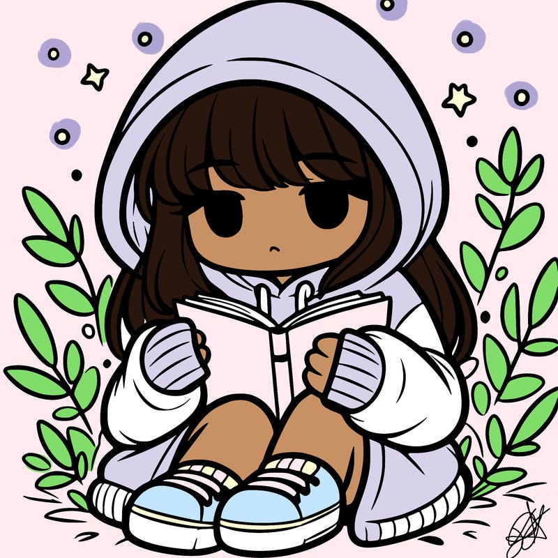 girl in oversized hoodie reading a book