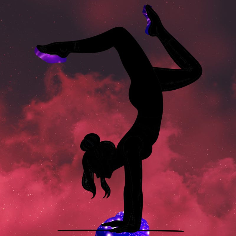 a woman doing a handstand