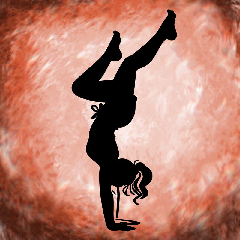 woman doing a hand stand