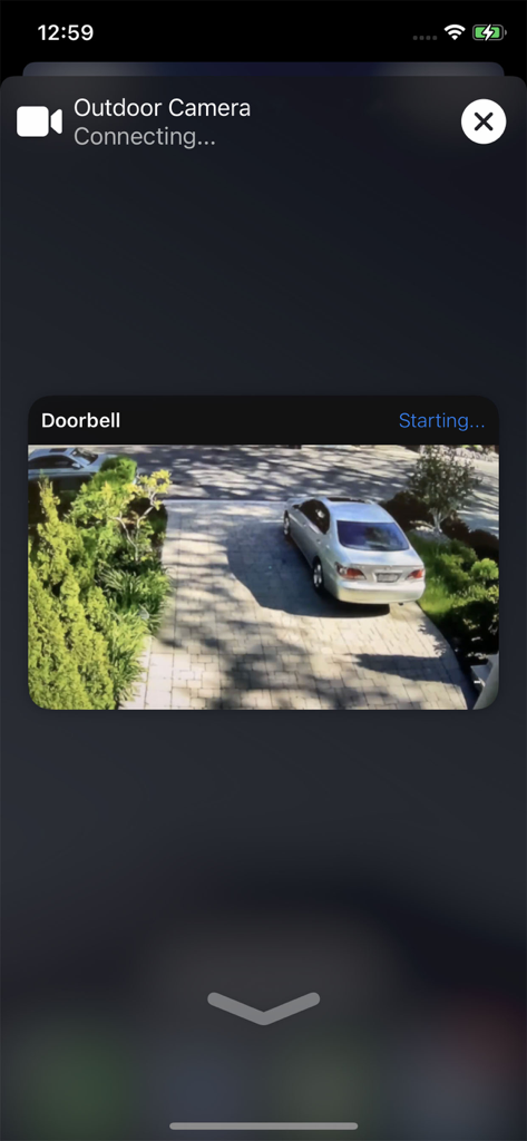 Home Widget - for HomeKit - Smart home interface showing a live outdoor camera and doorbell feed of a driveway on an iPhone.