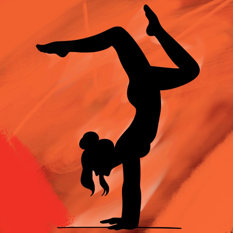 a woman doing a handstand