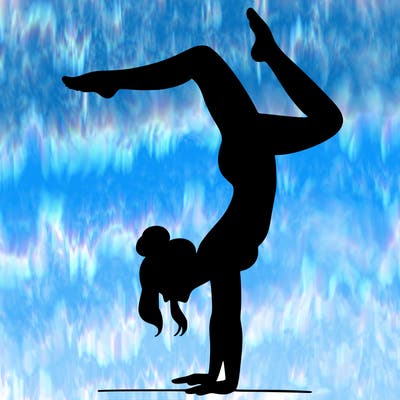 a woman doing a handstand