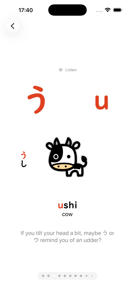 Pantalla de la aplicación de aprendizaje de japonés que muestra el carácter Hiragana 'u' con una ilustración de vaca y texto mnemotécnico