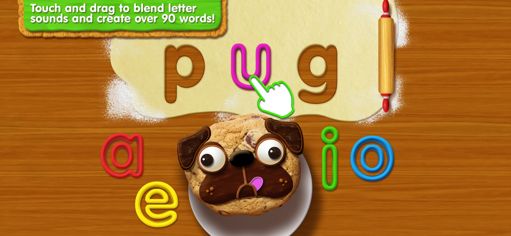 パグの形のクッキーの横に、pugという単語を綴るために文字をドラッグしている手が映っている教育ゲーム画面