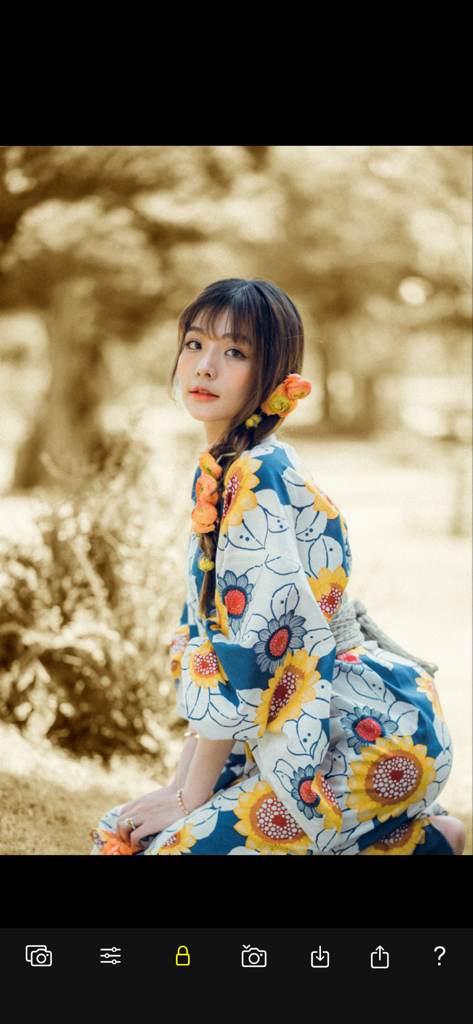 Color Focus Lens - A woman in a colorful floral kimono highlighted against a vintage sepia background using the Color Focus Lens app