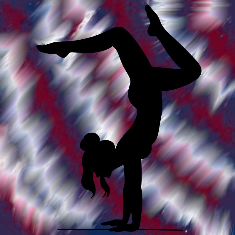 a woman doing a handstand