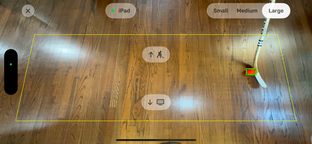Dangleverse - Augmented reality hockey puck tracking interface on a hardwood floor