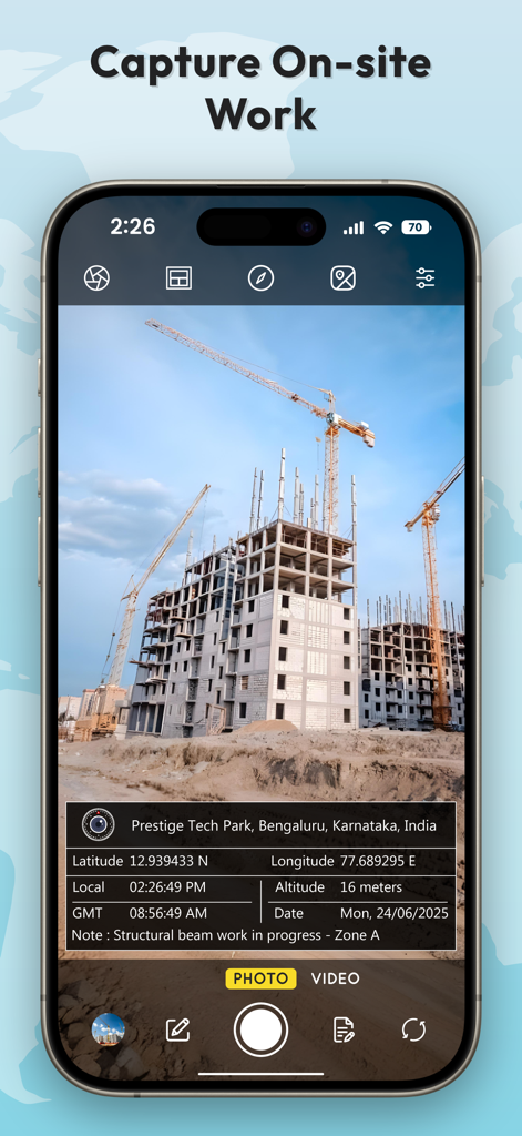 A smartphone showing a construction site photo with an overlay of GPS coordinates and timestamp information