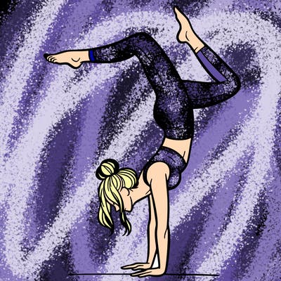 a woman doing a handstand