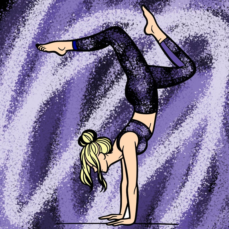 a woman doing a handstand