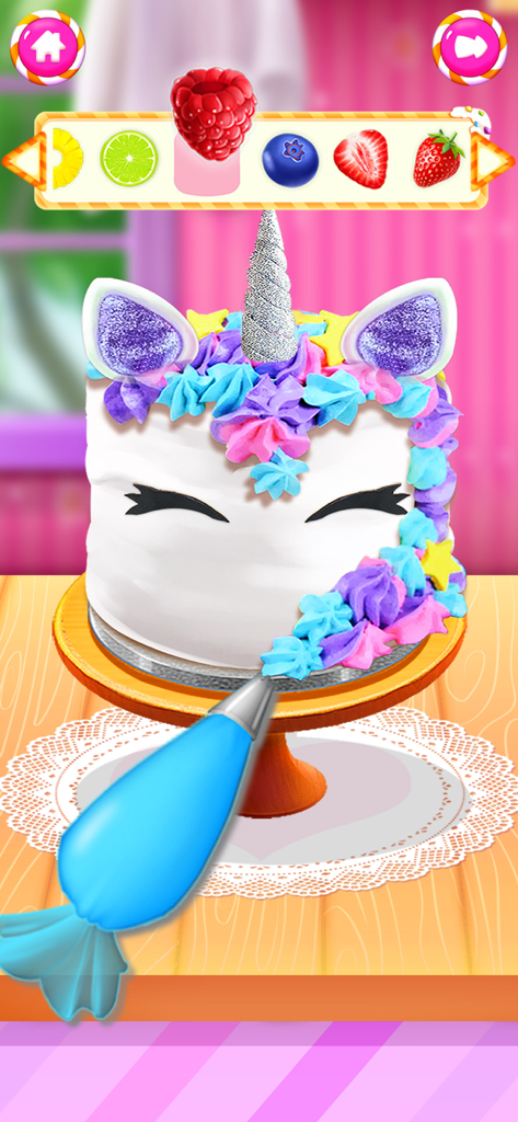 Food Cooking Baking Girl Games - A white unicorn cake being decorated with colorful frosting and fruits in a kids baking game