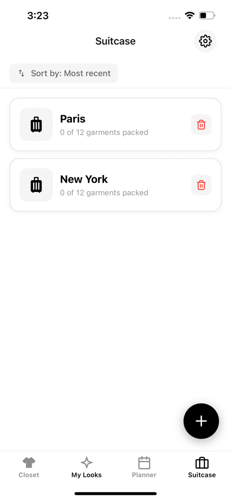 AI Dresser: Outfit Planner - Suitcase screen in the AI Dresser app showing organized travel packing lists for trips to Paris and New York