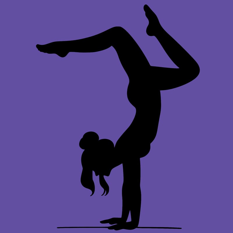 a woman doing a handstand