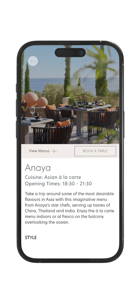Ikos Resorts mobile app screen for Anaya Asian restaurant featuring outdoor dining with an ocean view and a book a table option