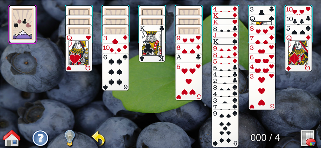 A game of solitaire in the All-in-One Solitaire Pro app with high-quality cards over a blueberry background.