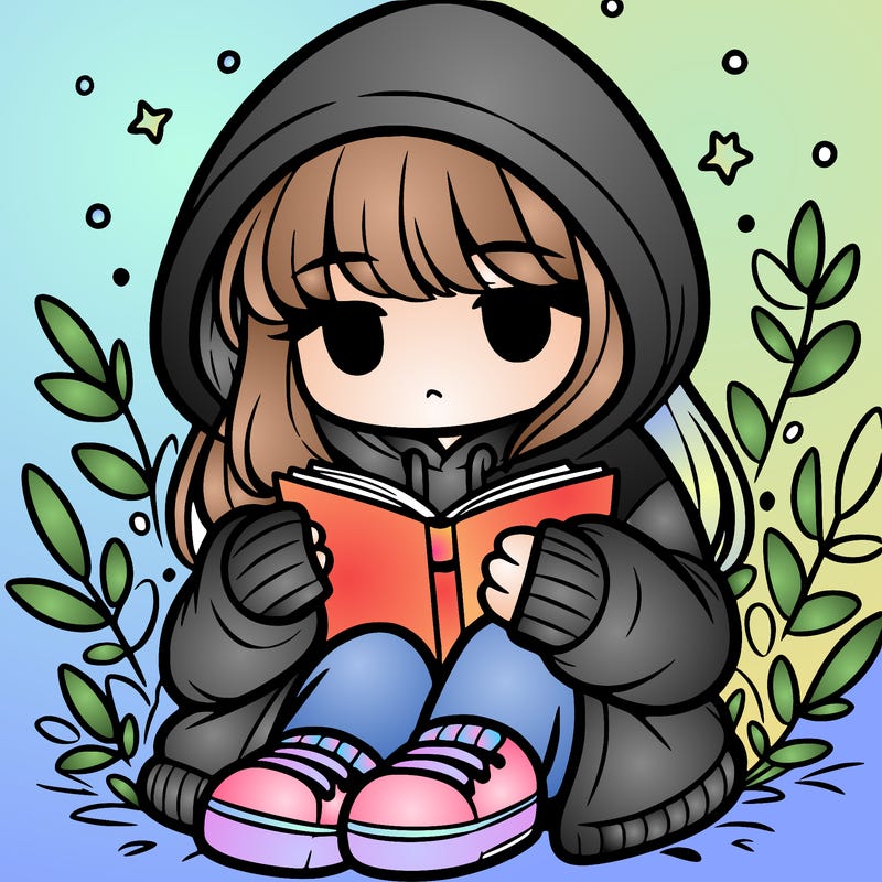 girl in oversized hoodie reading a book