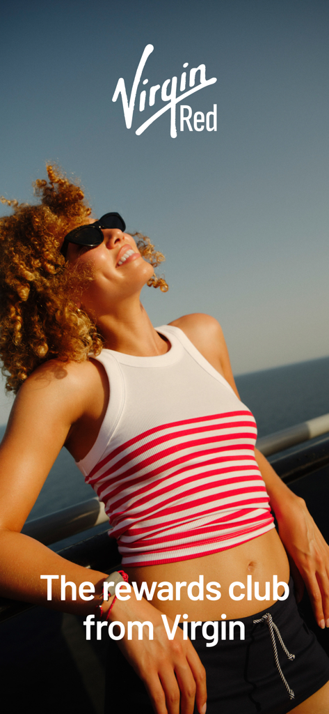 A smiling woman in sunglasses on a sun deck representing the Virgin Red rewards club