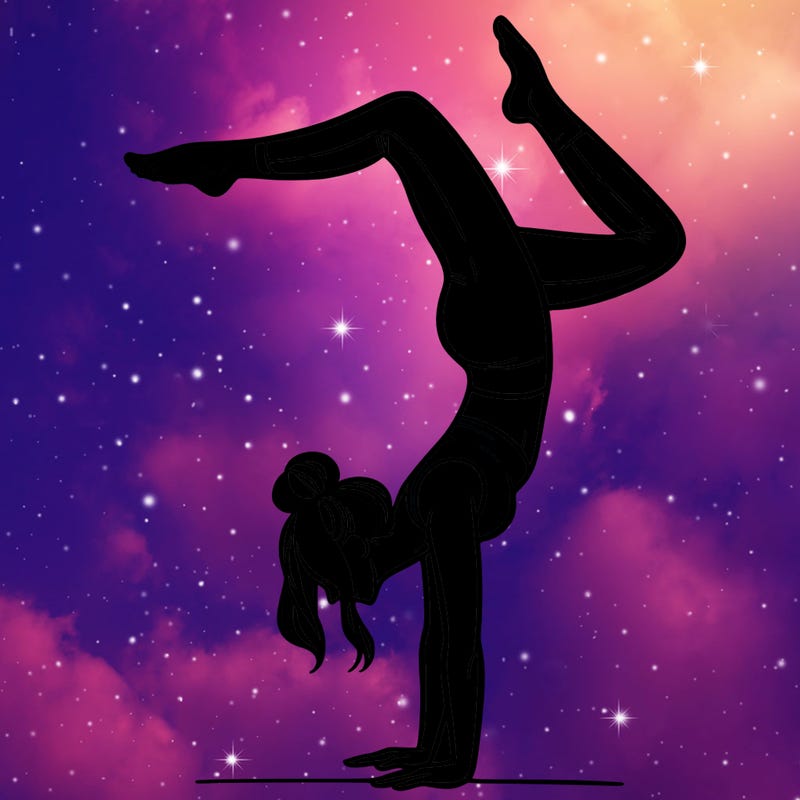 a woman doing a handstand