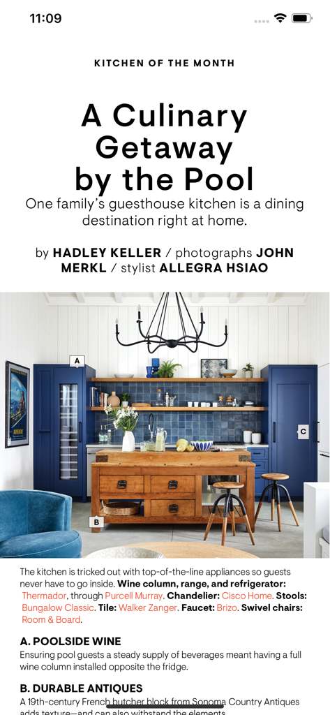 A Kitchen of the Month article in the House Beautiful app featuring blue cabinetry and a wooden island