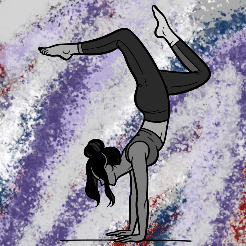 a woman doing a handstand