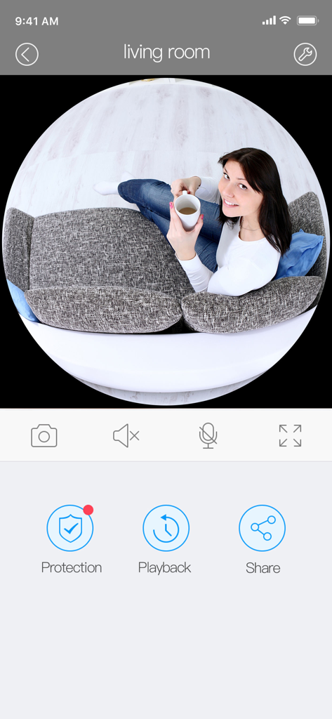 Clever Dog app live security camera feed showing a woman sitting in a living room