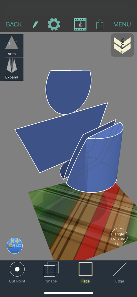 A blue 3D geometric shape being unfolded into a flat net on a virtual plane within the app